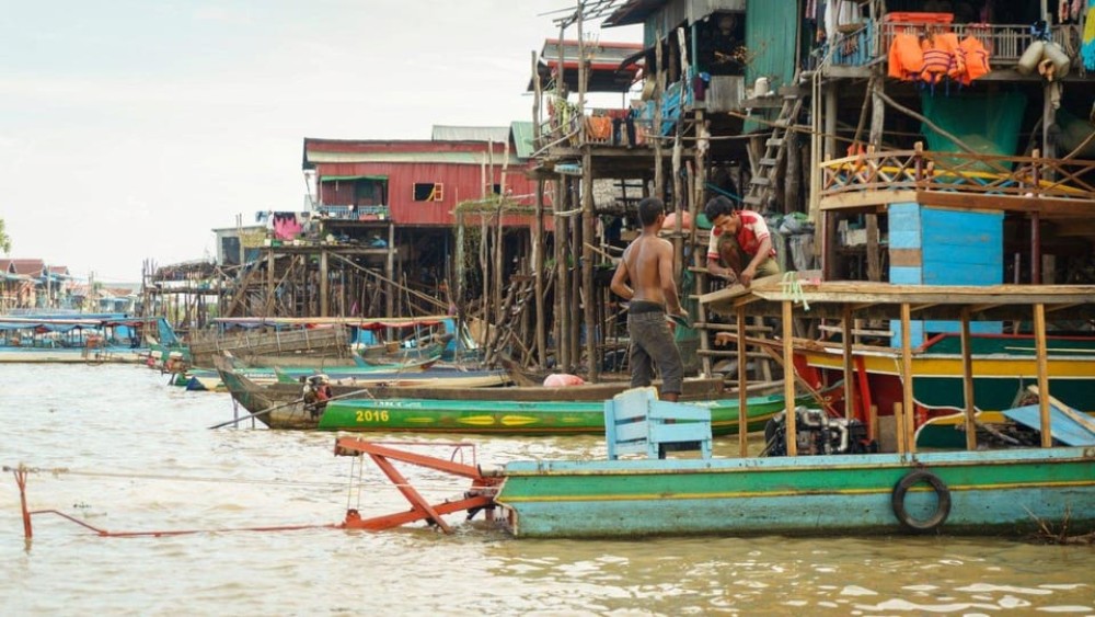 From Siem Reap: Kampong Phluk Floating Village Tour by Boat | ®ExcursionMania