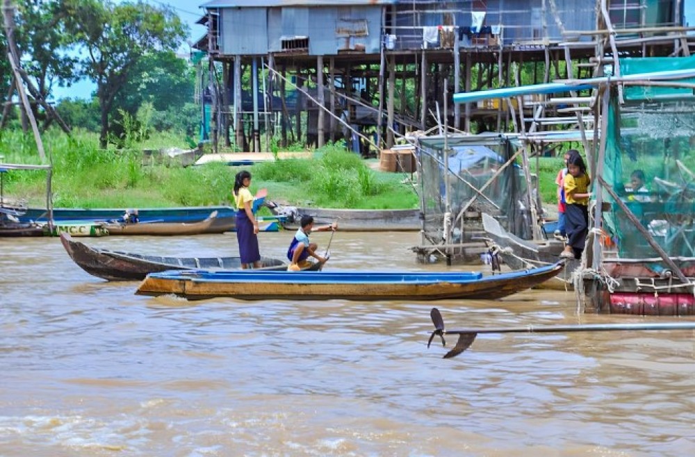 Siem Reap: Floating Village Sunset Boat Guided Vespa Tour | ®ExcursionMania