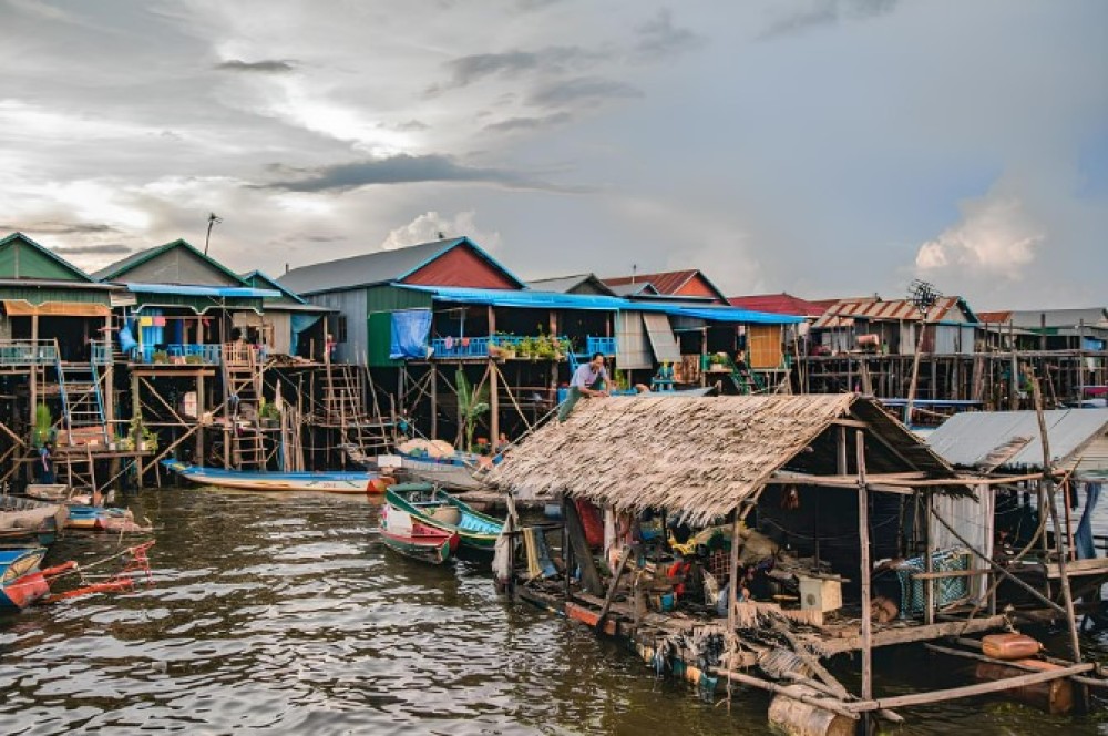 Siem Reap: Floating Village Sunset Boat Guided Vespa Tour | ®ExcursionMania